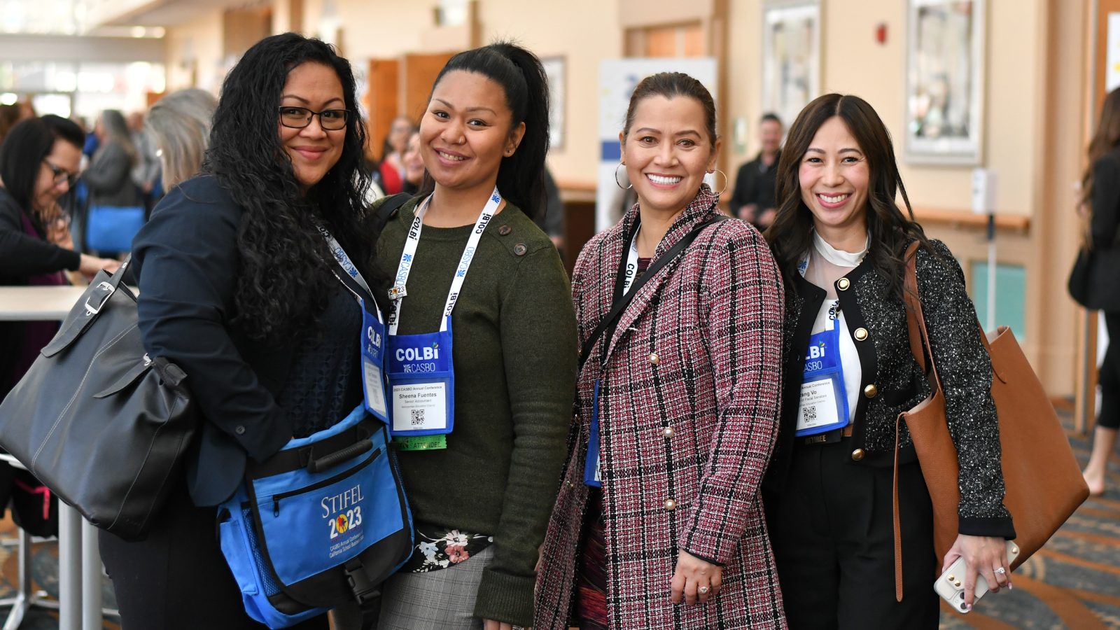 four woman smiling
