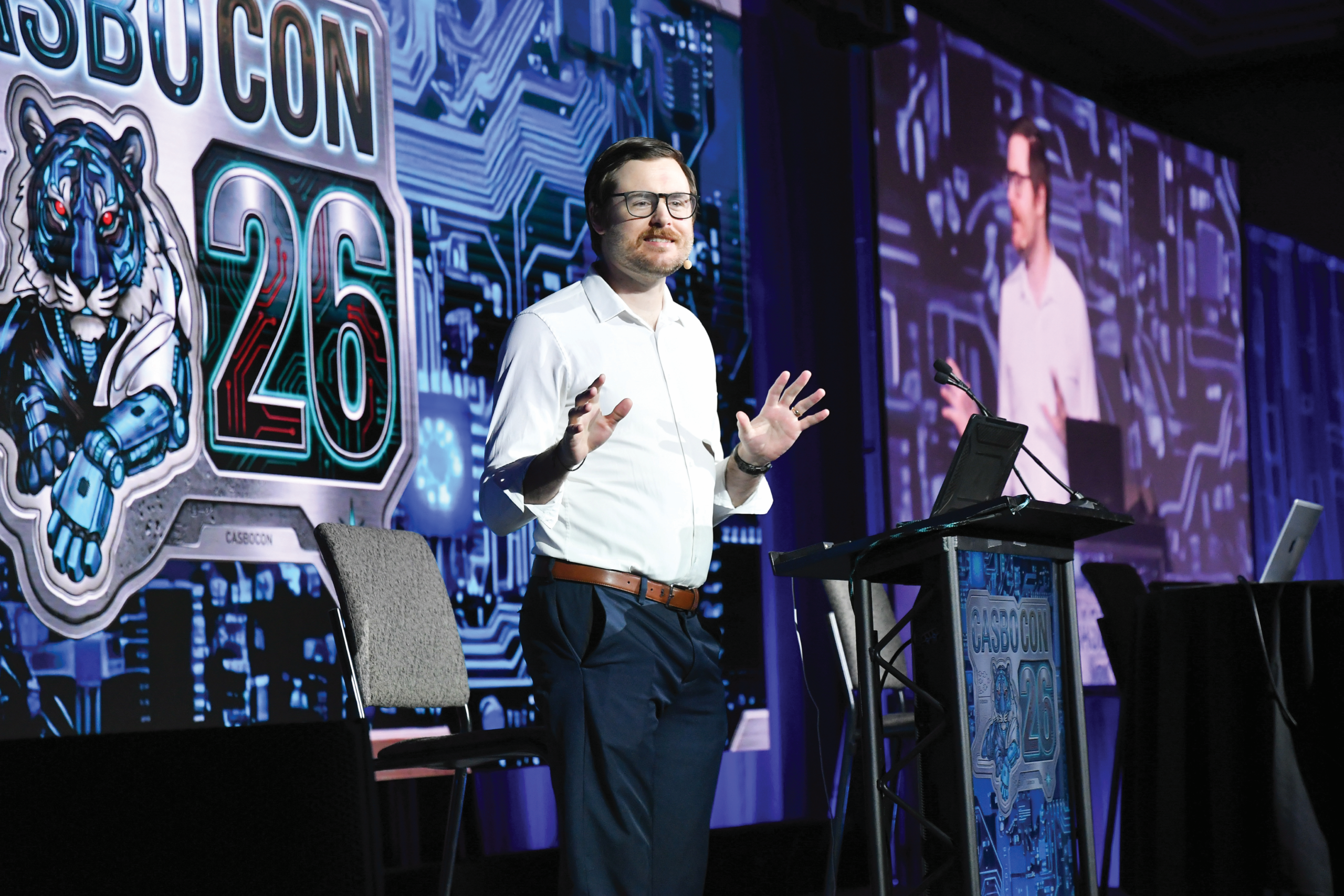 man speaking at conference